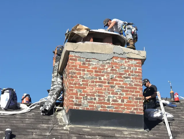 Belmont Chimney Sweep installing a custom chimney crown in Belmont, NC