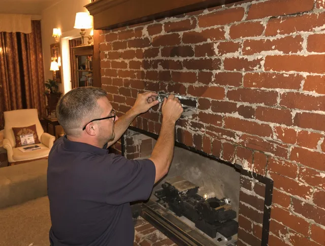 Belmont Chimney Sweep expert fixing a fireplace in Belmont, NC